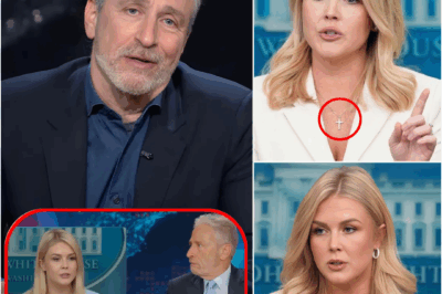 KAROLINE LEAVITT HUMILIATED BY JON STEWART — AND JUST DAYS LATER, SHE TOOK OFF HER CROSS NECKLACE. She finally ditched her signature necklace this week—right after Stewart torched her live on The Daily Show.